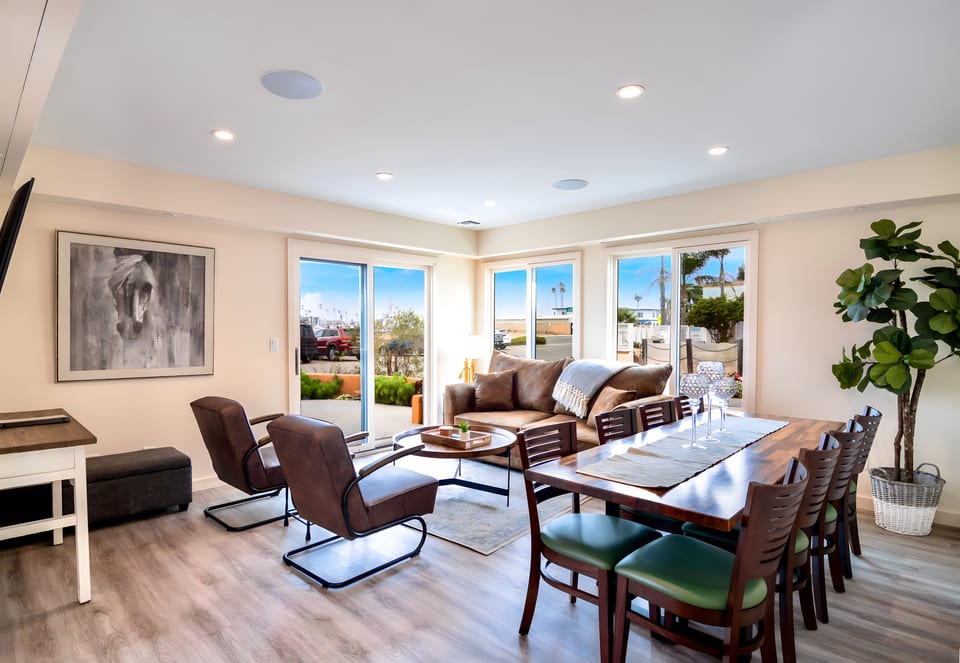 Open concept living room with sofa-sleeper with upgraded mattress, Smart TV, indoor seating for 8, outdoor seating for 6, and a cooks kitchen. Vacation heaven!