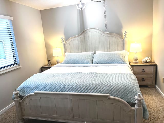 Master bedroom with king size bed. 