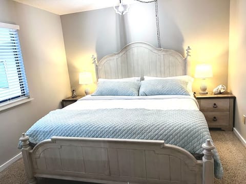 Master bedroom with king size bed.