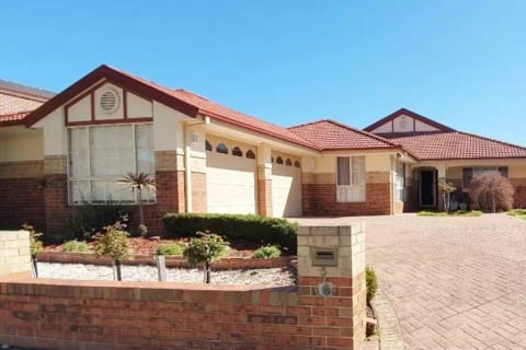 Front of the house with a huge driveway