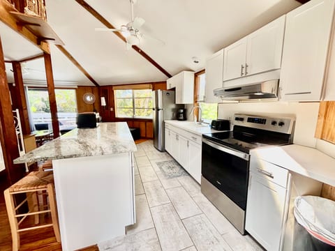 updated fully equipped kitchen with new large sitting island