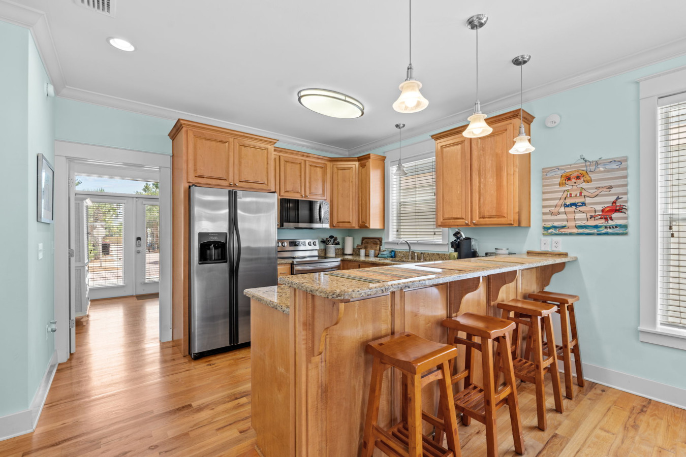 Start your morning with coffee at the breakfast bar or gather for happy hour at this inviting and well-appointed kitchen island.