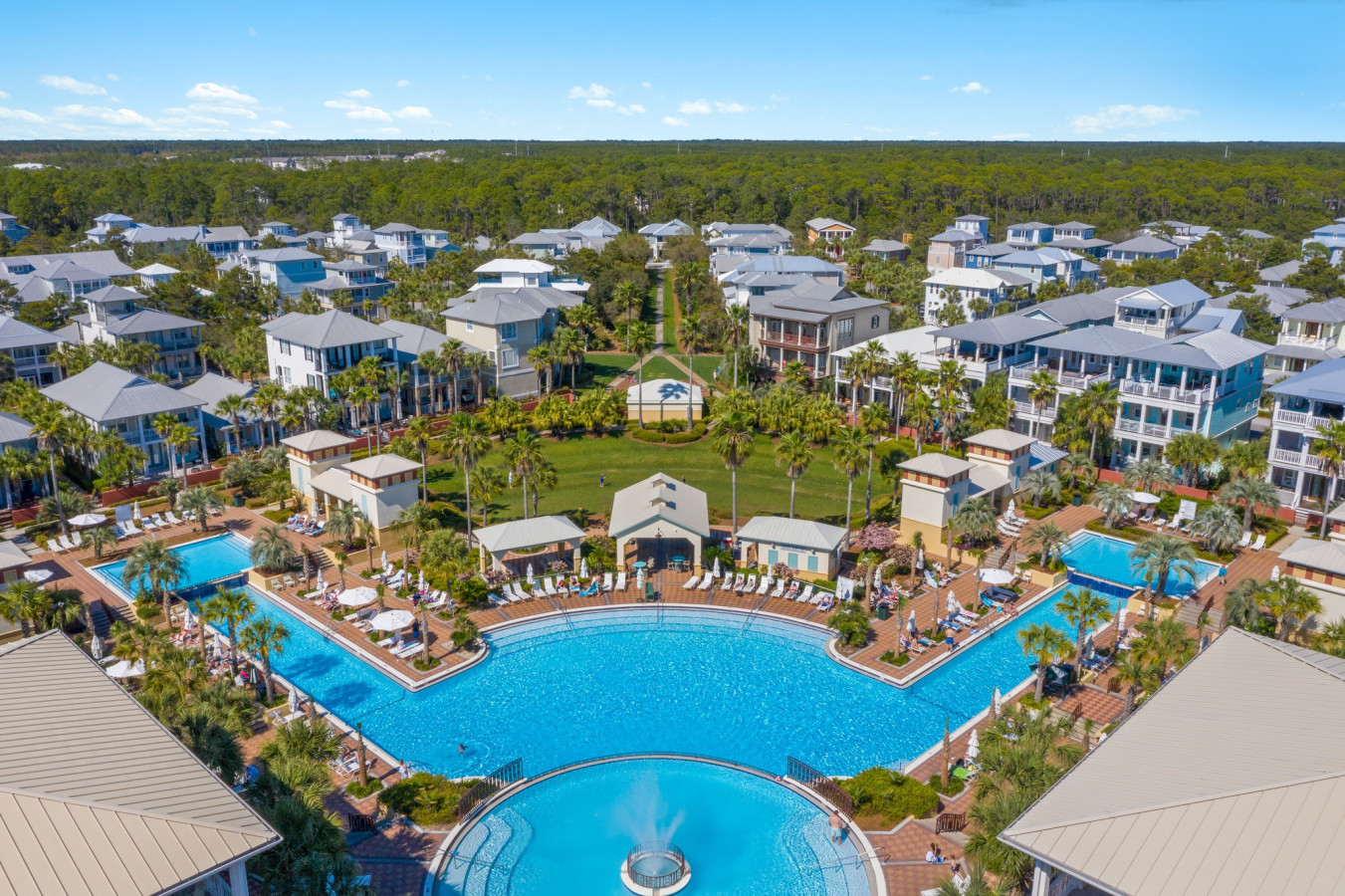 Dive into the resort-style experience at the heart of Seacrest Beach, where palm-lined paths lead to one of the largest pools on 30A.