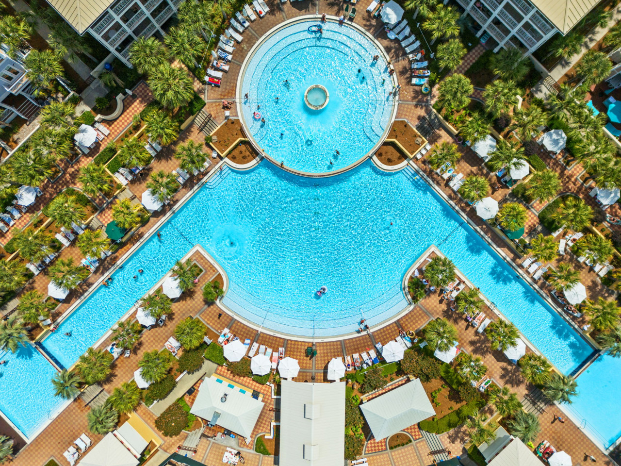 This impressive aerial view showcases the enormous lagoon-style pool, perfect for soaking up the sun or taking a refreshing dip.