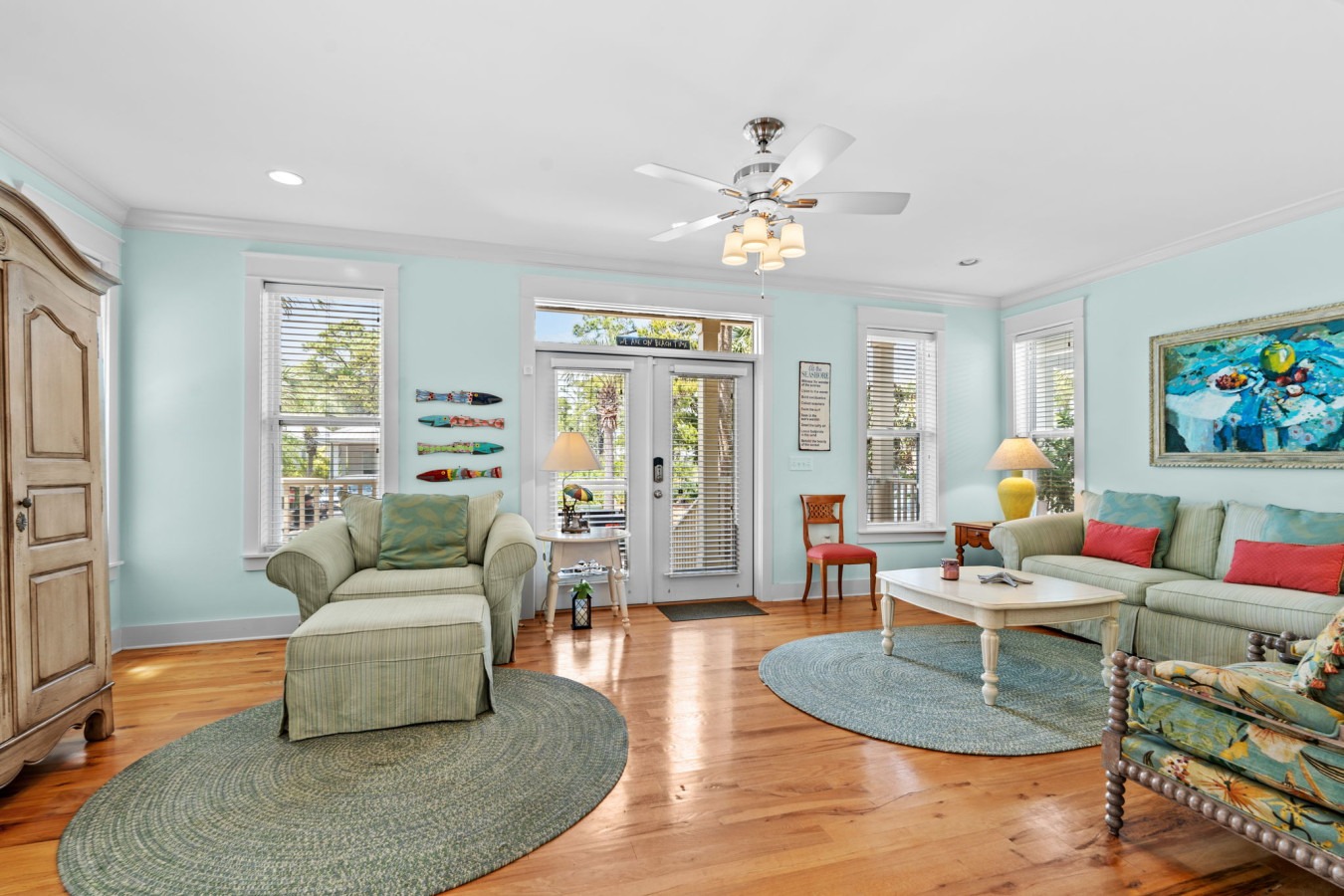 French doors and big windows let the Florida sunshine pour into this inviting and spacious coastal living area.