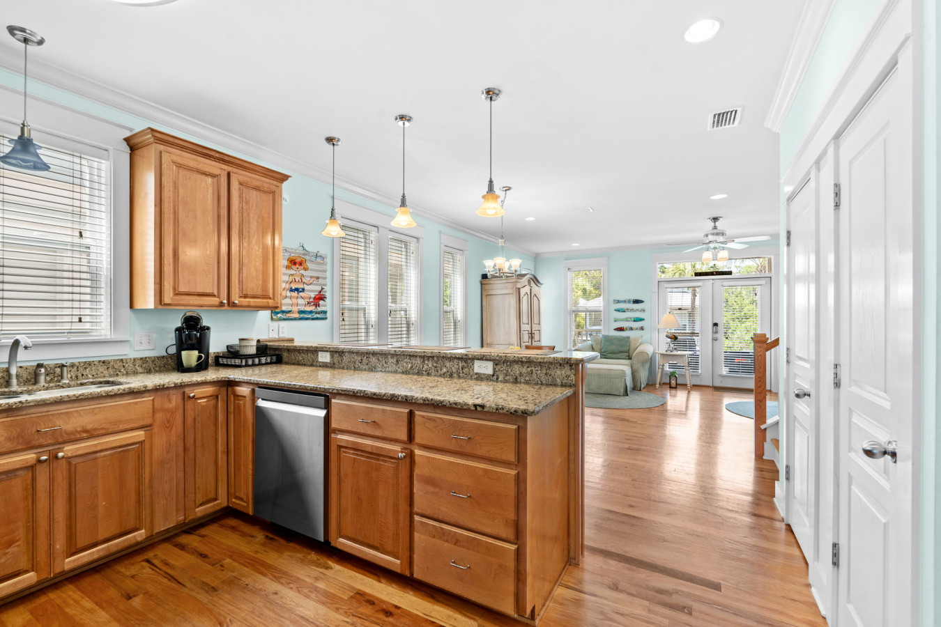 The spacious kitchen opens into the living area, creating the perfect setting for entertaining or relaxing with loved ones.