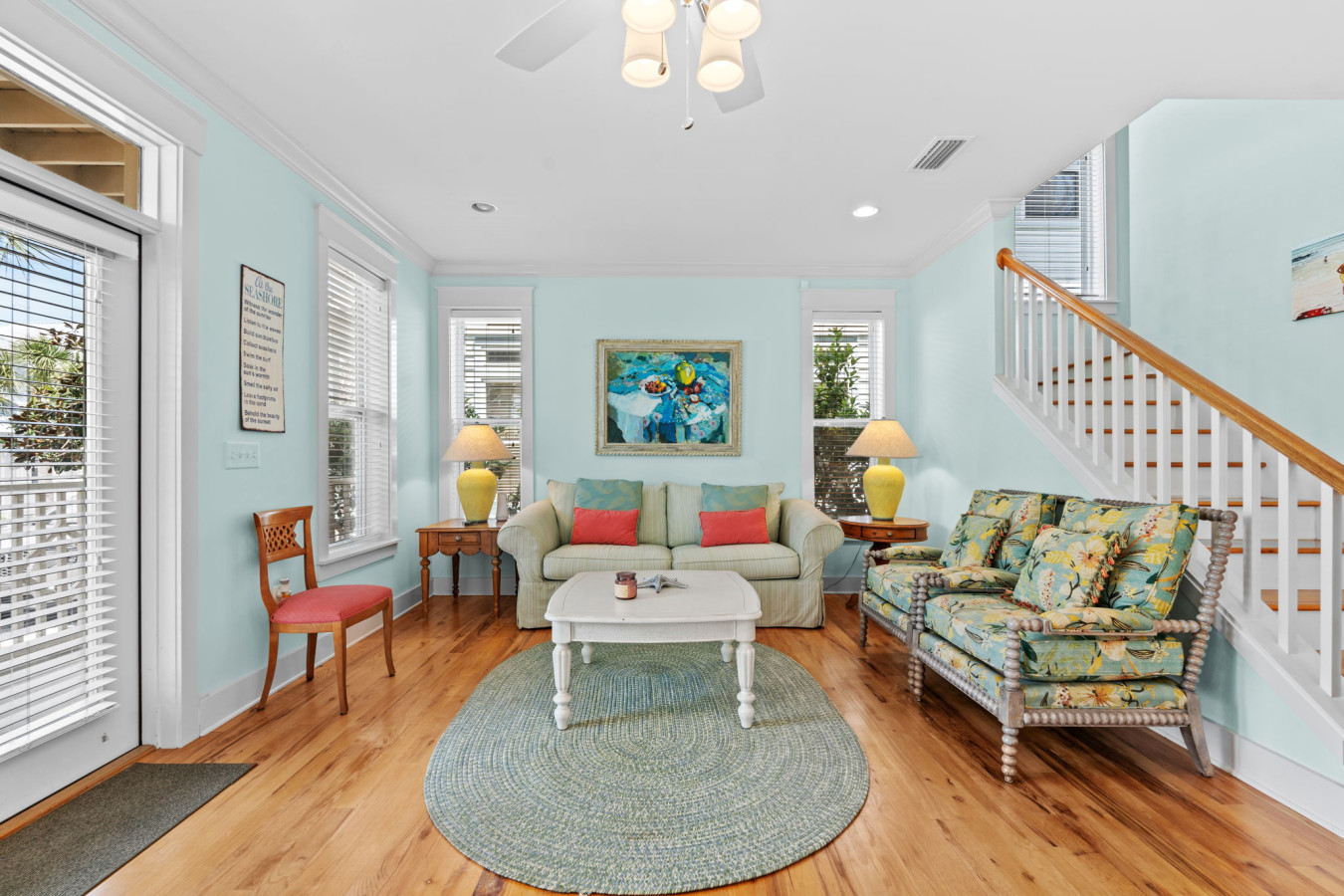This cheerful, beachy living space offers the perfect spot to unwind after a day in the sun with family or friends.