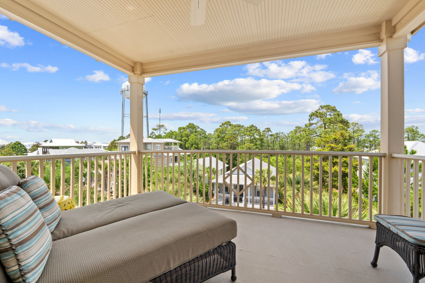 This inviting corner with a comfy armchair and large armoire opens directly to a balcony with beautiful views.