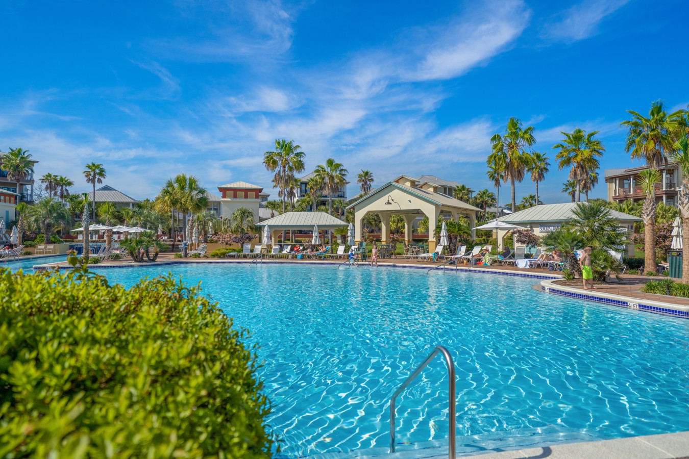Lounge under the Florida sun at Seacrest’s iconic poolside pavilions, perfect for relaxing between swims.