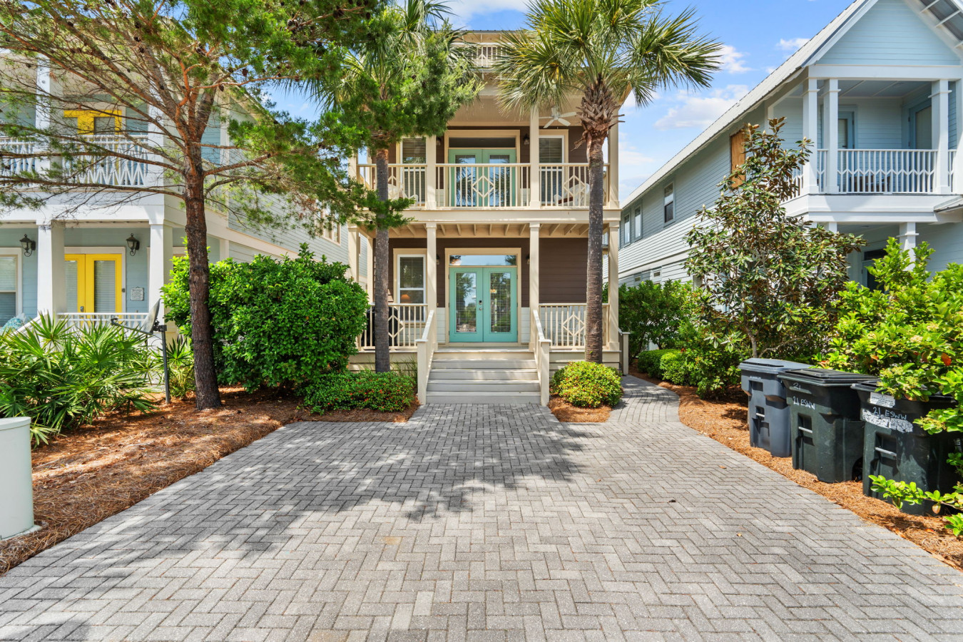 Spacious driveway and lush landscaping welcome you to this charming coastal retreat.