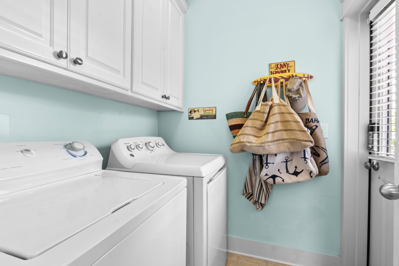 Enjoy the convenience of an in-home laundry room with plenty of storage and beach bags ready for your next adventure.