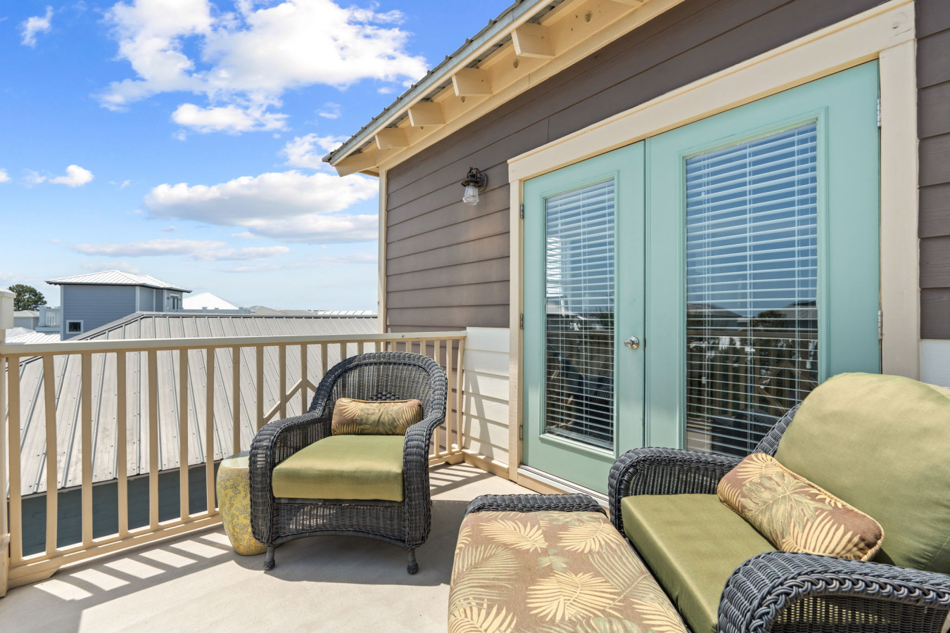 Step out from your bedroom to this cozy balcony lounge area, ideal for sipping coffee or unwinding with a book.