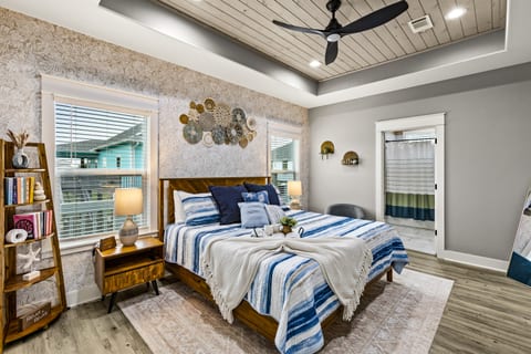 The Primary bedroom is calling! Sink into this King sized bed and enjoy a good book, or watch a show on the 65" Smart TV. Our Primary offers nightstands, lamps, alarm clock, ceiling fan, ensuite bathroom and walk-in closet.