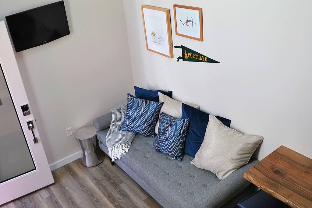 Looking down from the loft onto an oversized daybed.