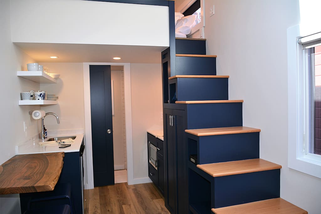 Custom stairway (with storage) leading up to the loft.