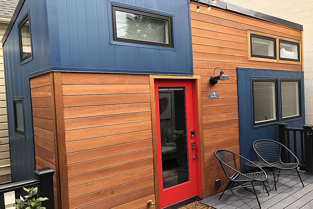 Exterior deck with tables and chairs.