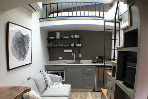 A second loft over the top of the kitchen with full-size bed.