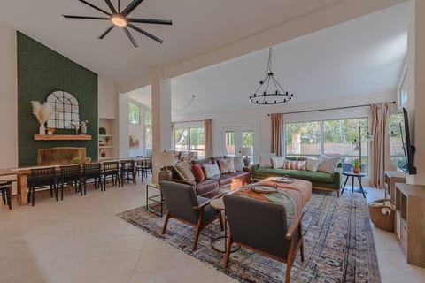 The family room with access through the dinning area and a beautiful view of the outdoor patio.