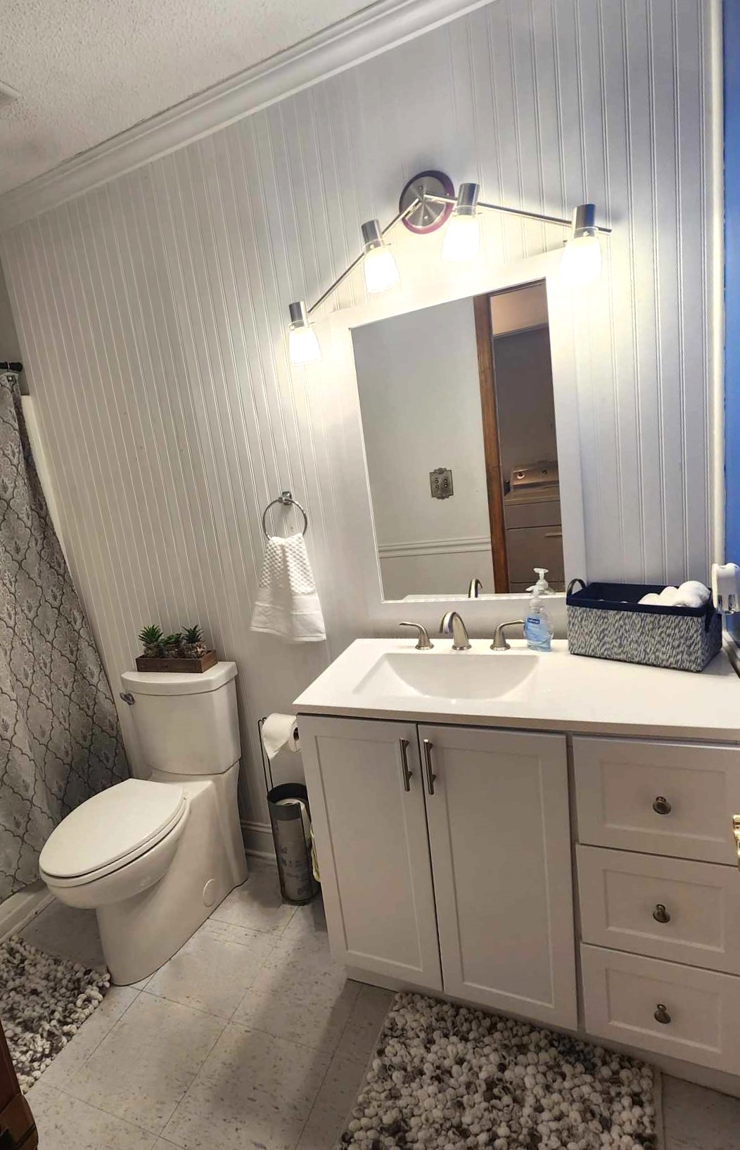 Bathroom #1: Complete Bathroom Package: Includes Toiletries, Bathtub Shower, and a Stylish Vanity Mirror.
