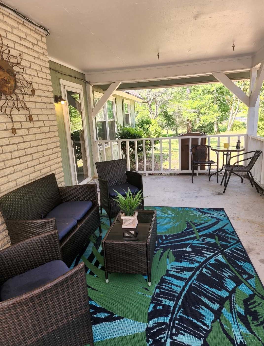 Welcoming Front Porch adorned with Brand-New Patio Furniture.