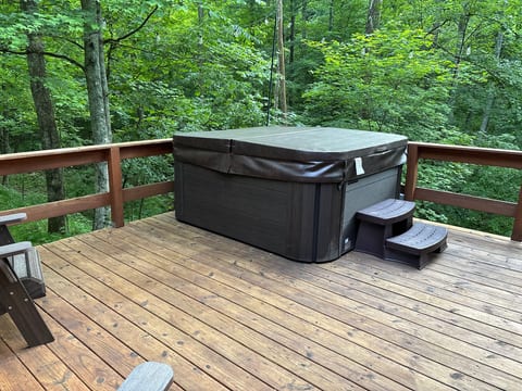 Private forest-view hot tub on a peaceful, spacious deck