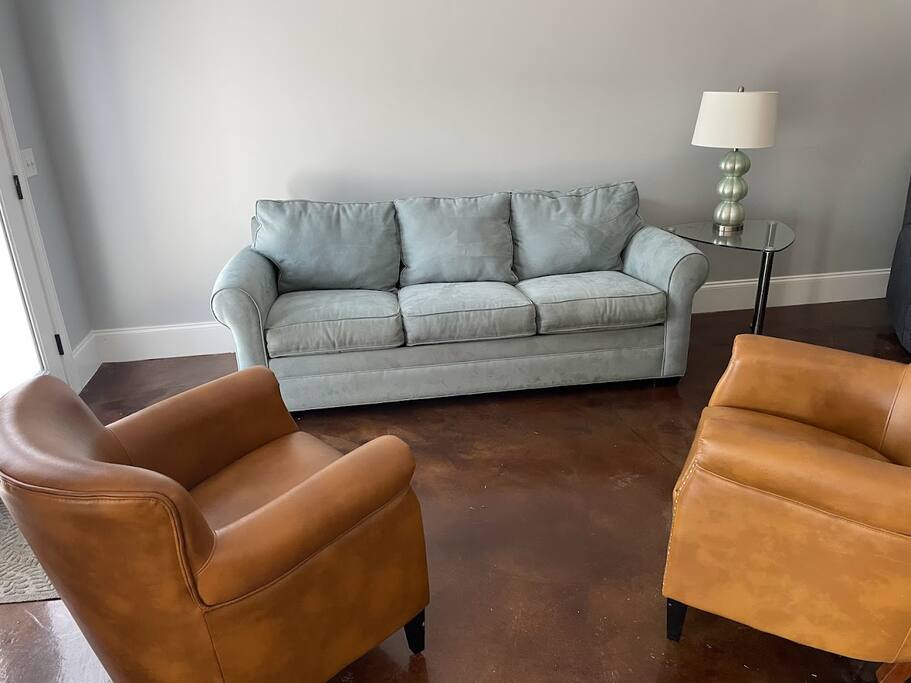 This pull-out queen sofa is situated in the walkout basement, on the same level as the double queen beds. It is not located in a bedroom but in an open area adjacent to the garage, which includes access to the pool and ping pong table. This pull-out queen sofa is situated in the walkout basement, on the same level as the double queen beds. It is not located in a bedroom but in an open area adjacent to the garage, which includes access to the pool and ping pong table. - Chalet on Lake Wylie, Waterfront w/Beach/Sleeps 16 - Belmont