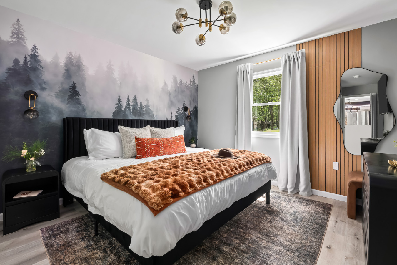 Relax in the luxurious king bed, nestled in a cozy, mountain-inspired retreat.