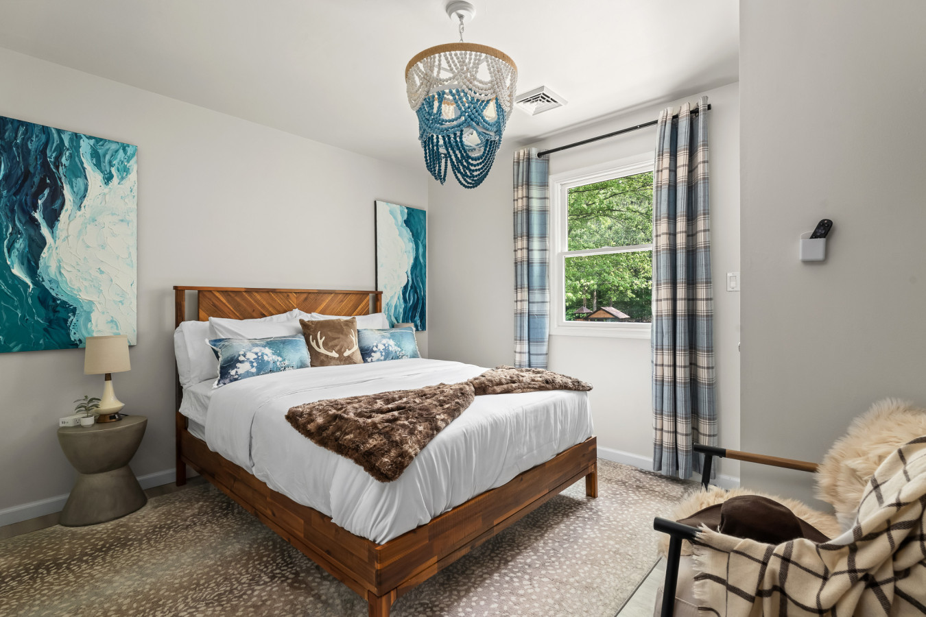 Unwind in this luxurious queen bed, featuring soft textures and elegant decor—your ideal escape.