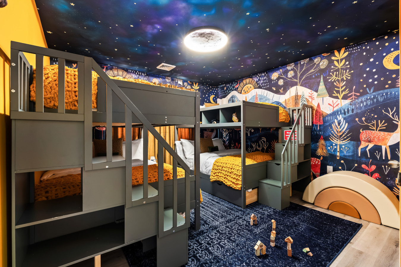 Enchanting bunk room with delightful woodland decor—where imagination takes flight!