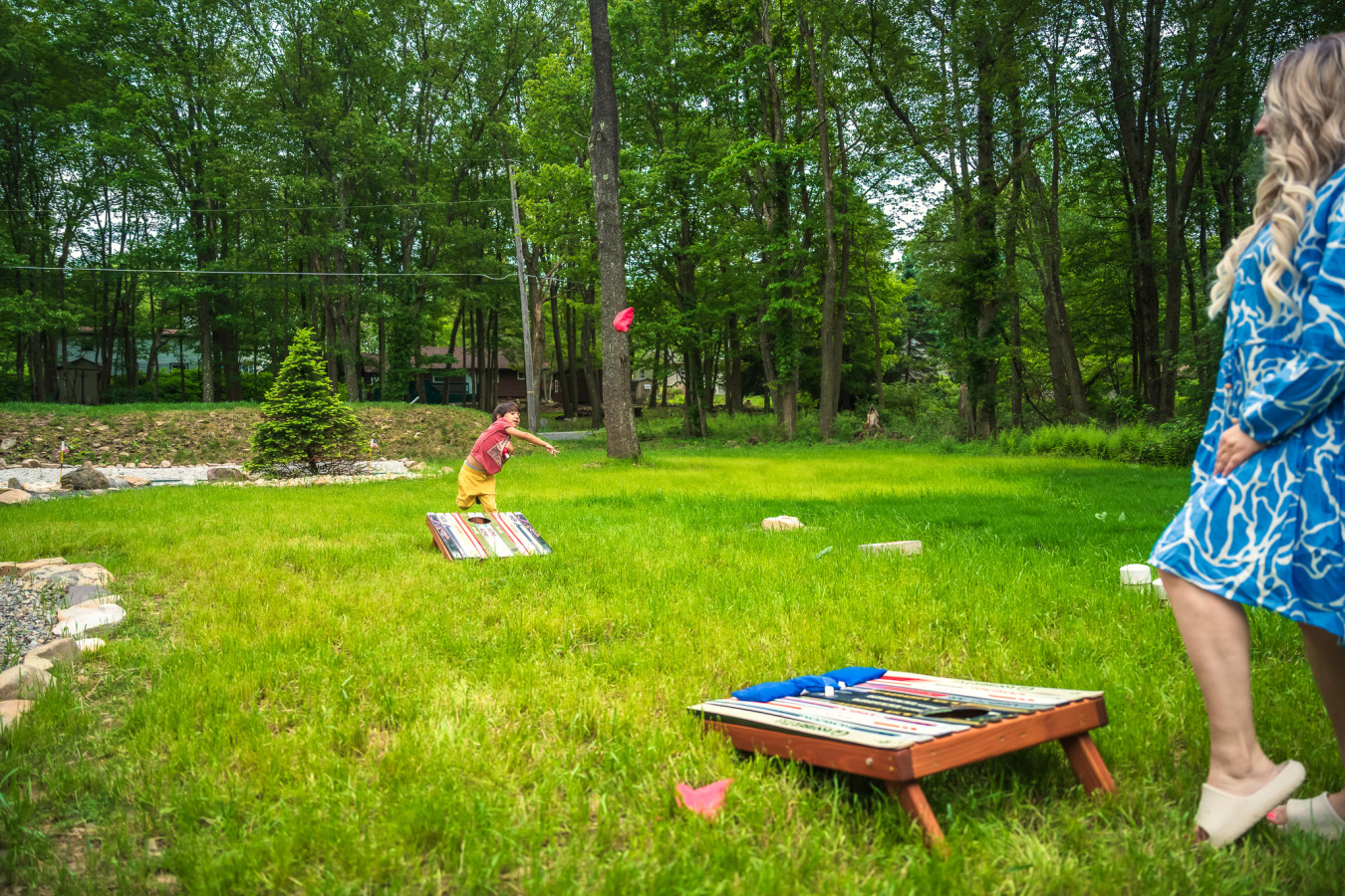 Enjoy some friendly competition with a game of cornhole in the backyard — fun for all ages!