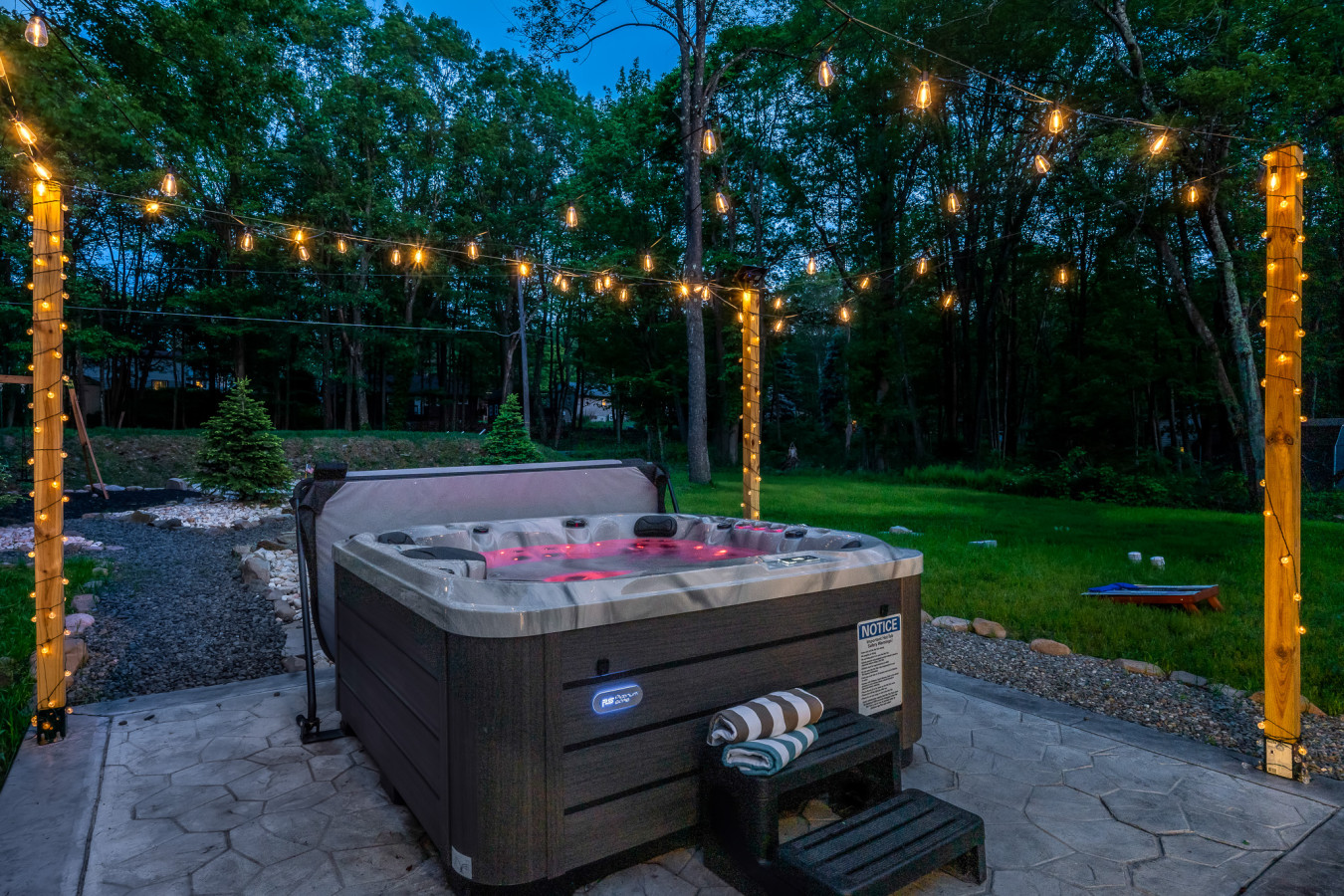 Relax under the stars in our hot tub, beautifully lit for a serene evening experience. Perfect for unwinding after a day of adventure!