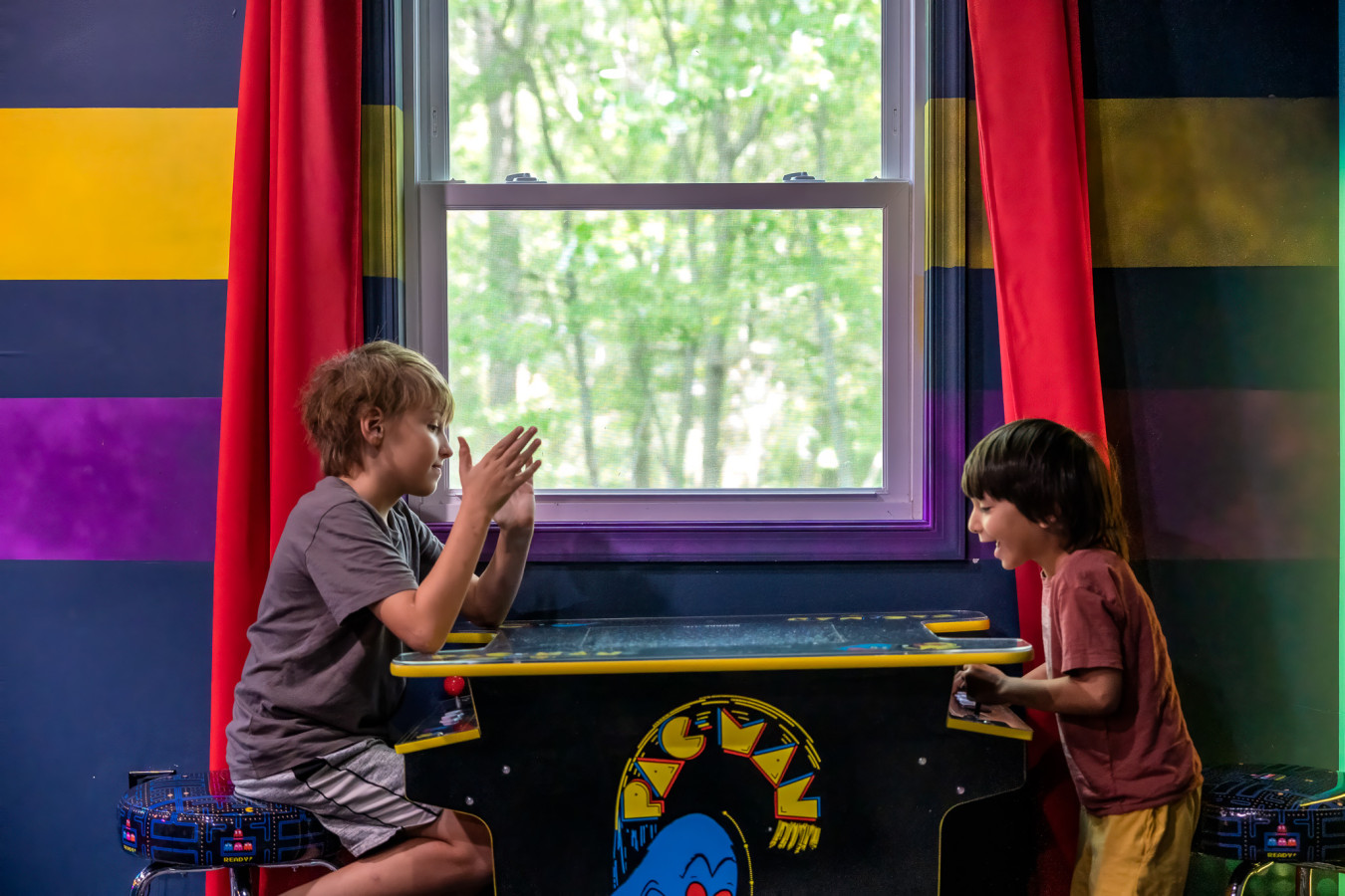 Bring on the nostalgia with a classic Pac-Man arcade game — fun for all ages in the game room!