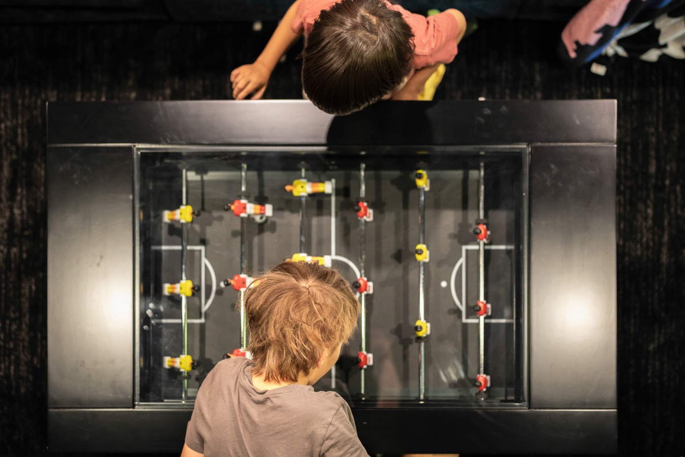 Get ready for some friendly competition with a game of foosball in our fun-filled game room.