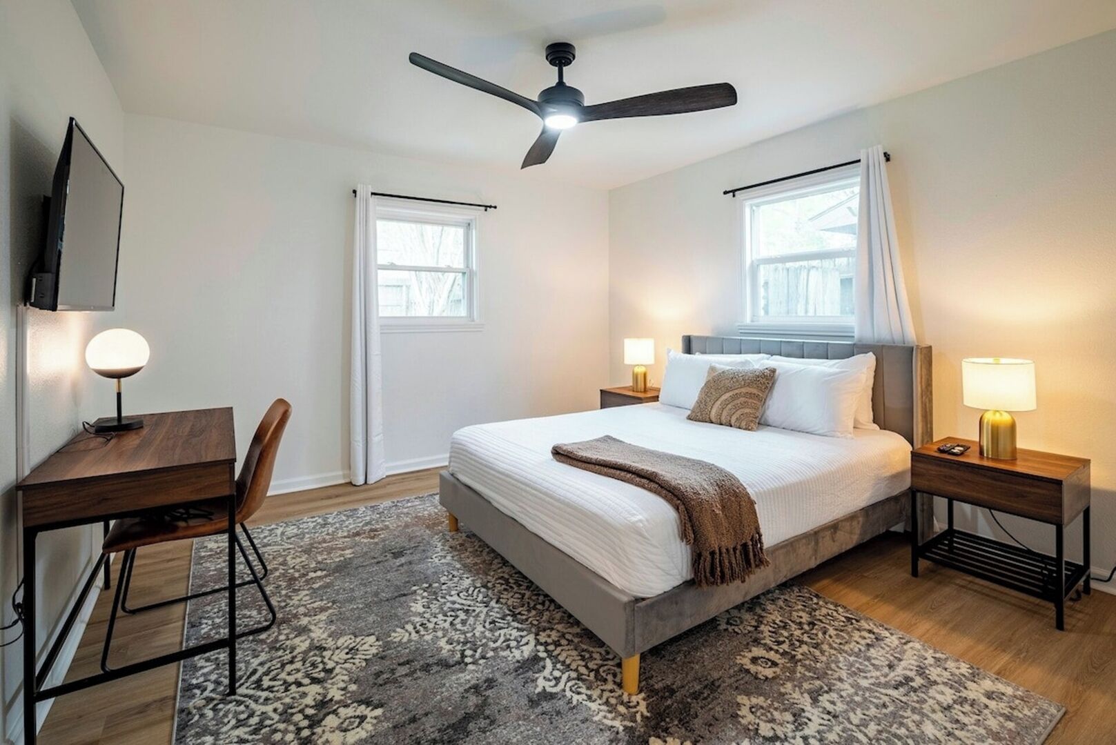 This bedroom offers a plush, 12 inch memory foam queen sized bed, writing desk, smart tv, walk-in closet, room darkening curtains and more.