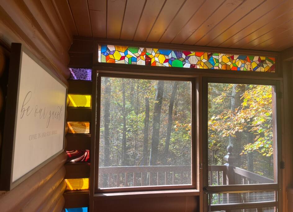 Take in the beauty of the stained glass on the screened porch as the evening sun filters through.