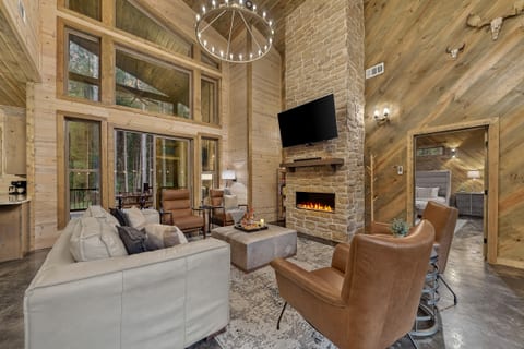 Cozy up on the oversized couch or recline and kick your feet back while you enjoy the ambiance of this property.