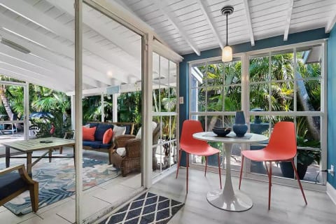 The Breakfast Nook off the Screened-In Porch and adjacent to the kitchen is an easy favorite spot in the home. The outdoor fountain sets the cozy mood as you have a cup of coffee and prepare for the day.