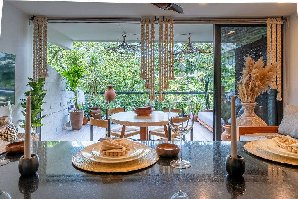 Sleek, Fully-Stocked Kitchen and Terrace Adorned with Exotic Plants