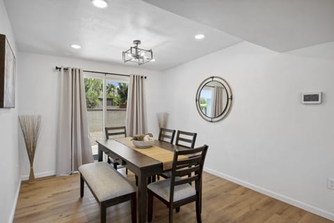 Simple dining area w/ natural light, ideal for shared meals or morning coffee.