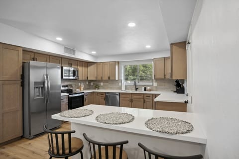 Open kitchen w/ ample counter space & modern appliances, great for cooking at home.