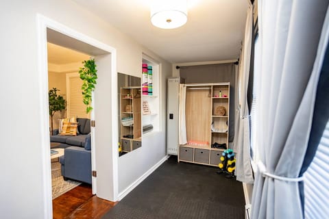 Enjoy workouts at home in the gym / yoga area fully stocked with foam rollers, yoga mats, resistance bands, dumbbells, gym locker, mirror, exercise charts, and more!