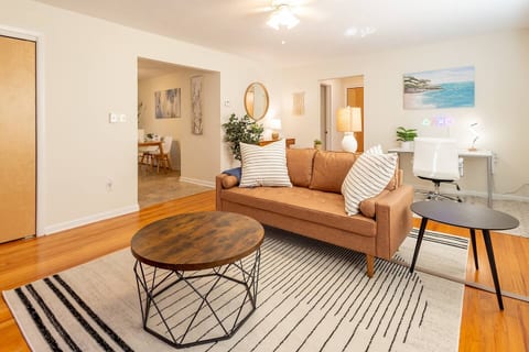 Enjoy this stylish and large living room that is brightly lit with a lot of natural light.
