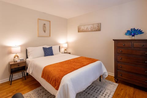 The 2nd bedroom features a Queen-sized bed with luxurious foam mattress, blackout curtains, noise machine, ear plugs, and more to ensure you have the most comfortable sleep! An office workstation is perfect for those who work from home.