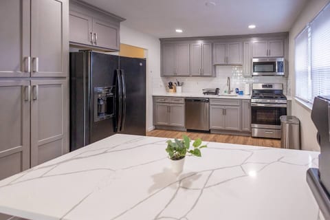 Cook your favorite meals in this newly renovated kitchen that is fully stocked with cookware, featuring new appliances, dishwasher, and everything you need.