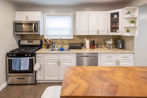 Cook your favorite meals in this newly renovated kitchen that is fully stocked with cookware, featuring stainless steel appliances, dishwasher, herbs & spices, and more!