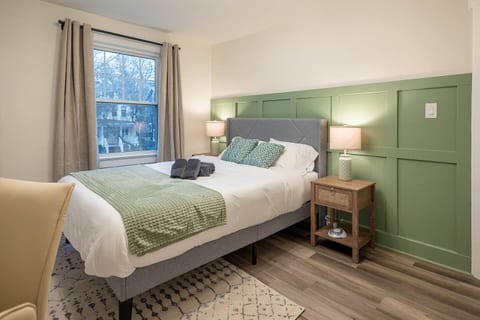 The 1st bedroom features a Queen-sized bed with luxurious foam mattress, blackout curtains, noise machine, ear plugs, and more to ensure you have the most comfortable sleep! An office workstation is perfect for those who work from home.