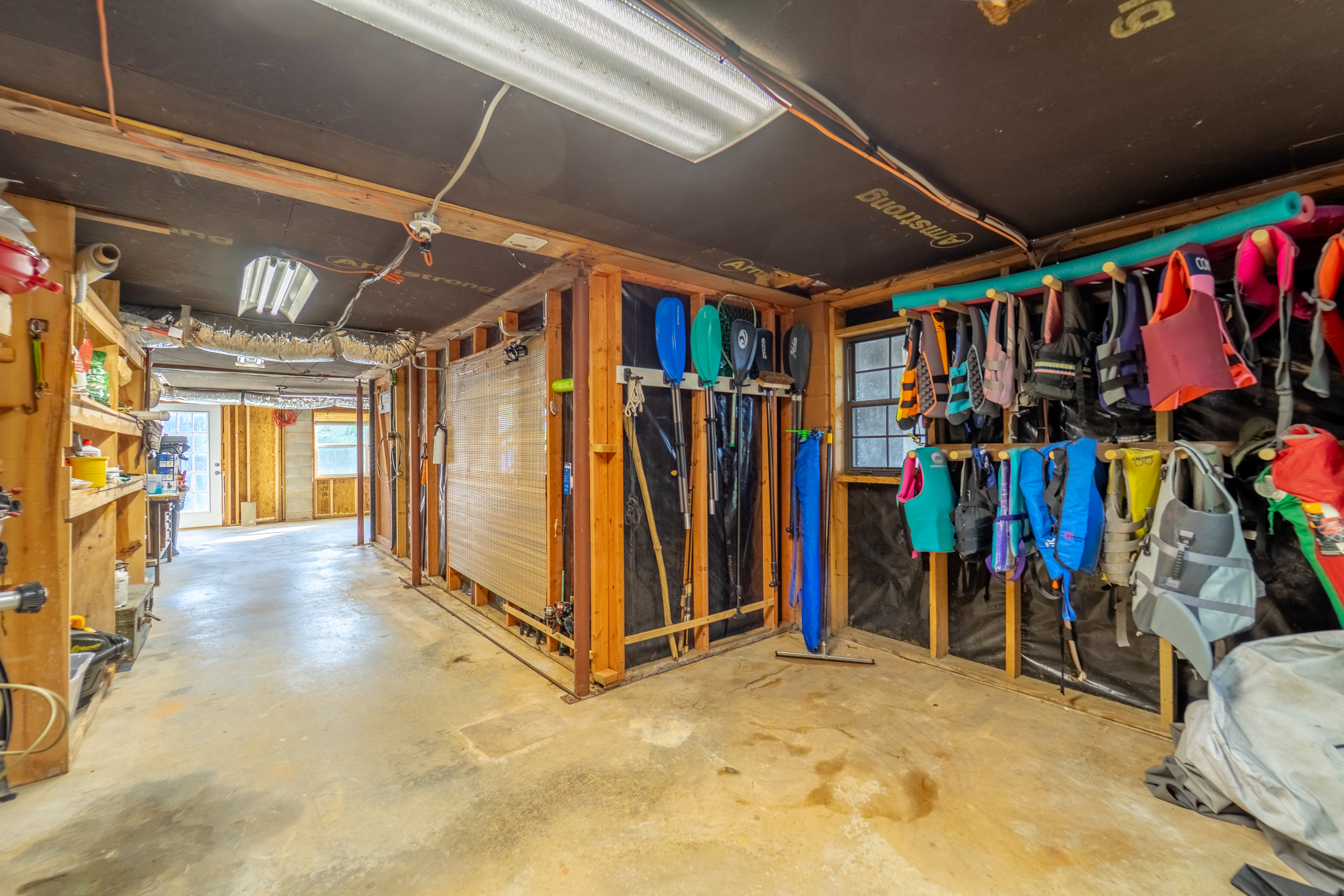 Basement with Access to Water Toys, Life Jackets, Fishing Poles, and More! - A Point of View - Robbinsville