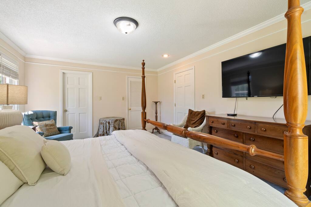 A comfy armchair offers the perfect perch for morning coffee or an evening read, with a nearby table to hold your book, drink, or whatever you need close by. Enjoy your favorite shows on the large TV from the comfort of bed or chair.
