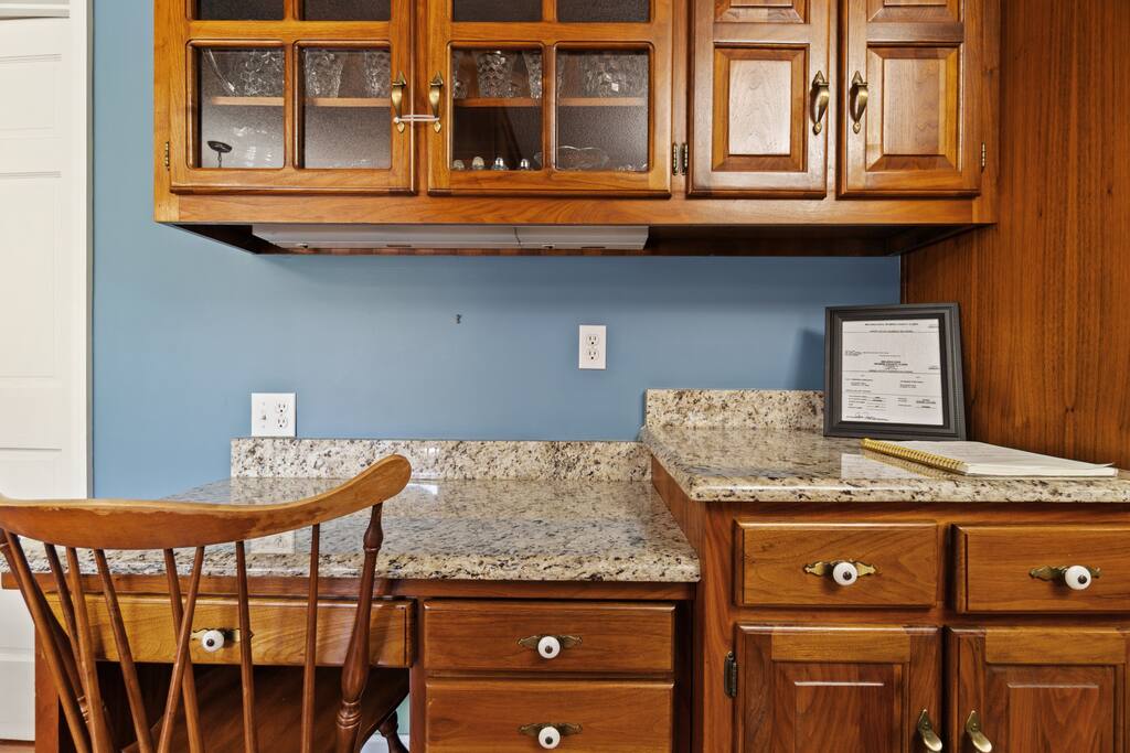 Need to get a little work done while you're away? The kitchen includes a convenient desk setup, perfect for staying productive during your stay