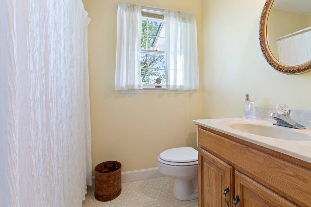 The bathroom features a convenient shower and tub combination, perfect for a quick rinse or a relaxing soak